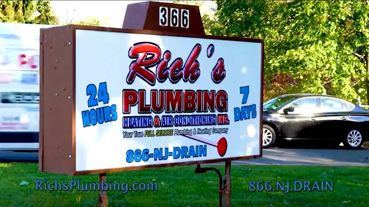 The Rich's Plumbing Heating & Air Conditioning sign outside the East Brunswick shop: 24 hours, 7 days